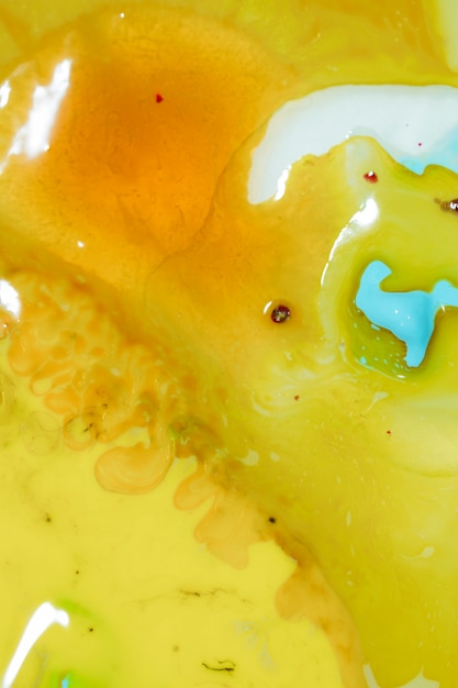 Free photo fluid yellow slime with copy space