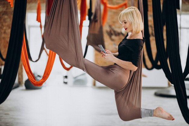 Fly yoga female instructor at the gym