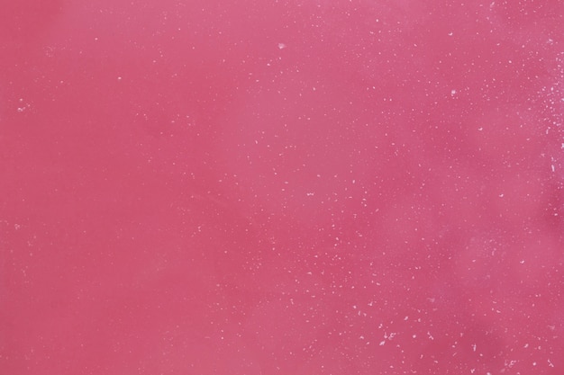 Free photo foam flakes on pink water