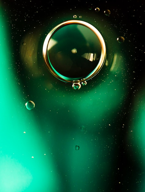 Free photo focused bubbles front view with green blurred background