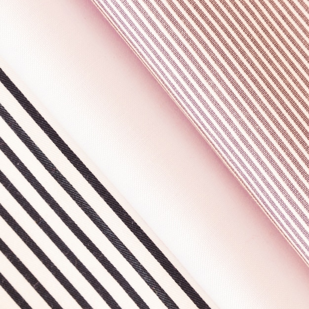 Free photo folded black and pink stripes fabric