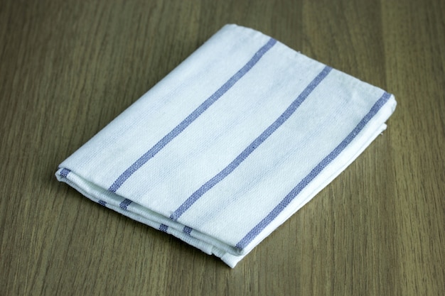 Free Photo folded napkin on wooden table