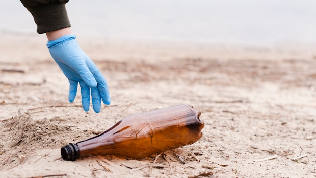 Font view of hand and plastic bottle