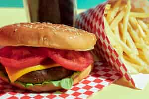 Free photo food arrangement with cheeseburger and fries