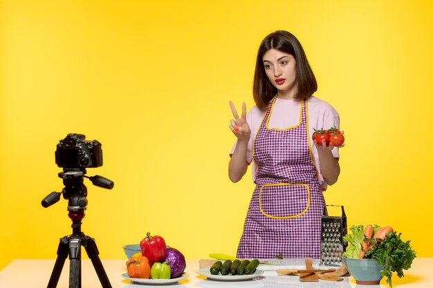 Food blogger cute fitness cook recording video for social media with red pepper