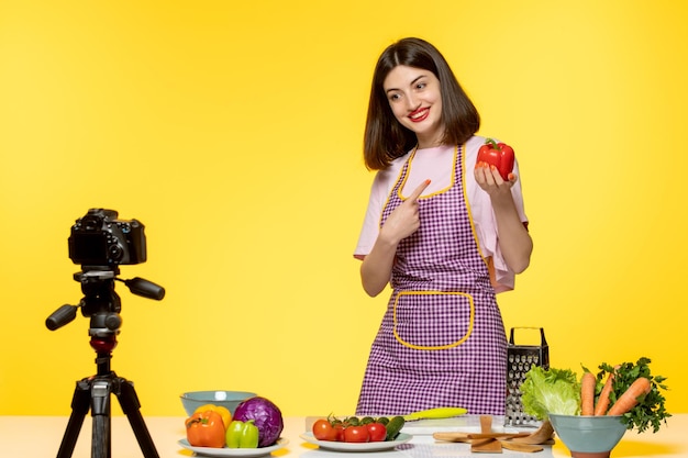 Food blogger healthy fitness chef recording video for social media with bell pepper