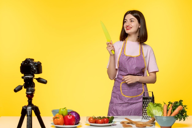 Free photo food blogger healthy fitness chef recording video for social media with a knife