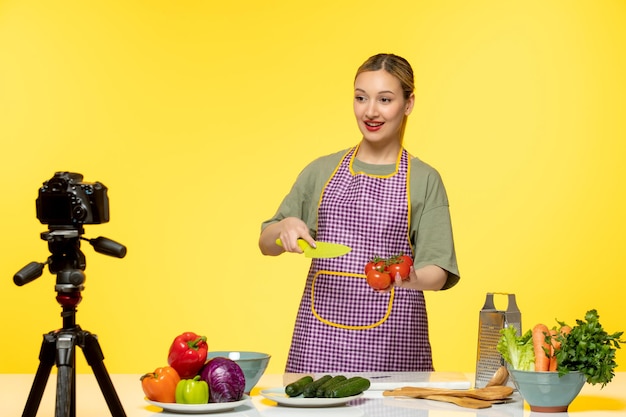 Free photo food blogger young fitness cook recording video for social media explaining how to make salad