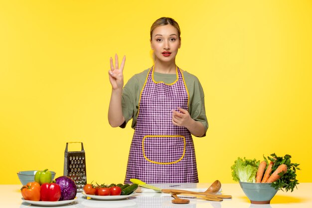 Food blogger young fitness cook recording video for social media showing three minutes