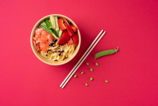 Free photo food bowl and chopsticks top view