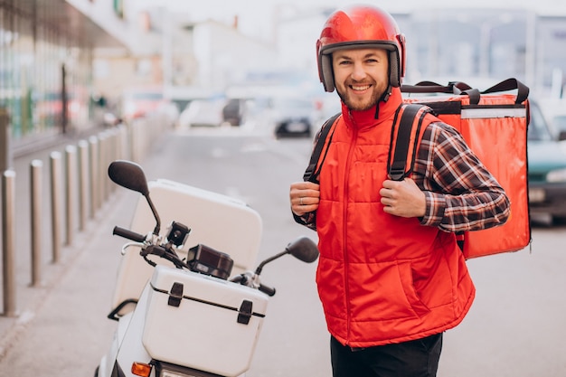 Free photo food delivery boy delivering food on scooter