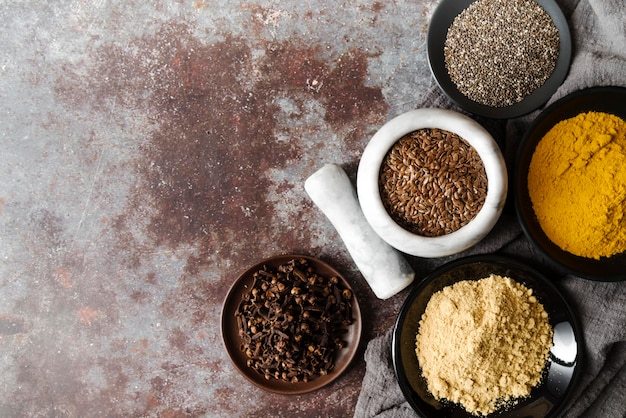 Food powder and seeds in bowls copy space