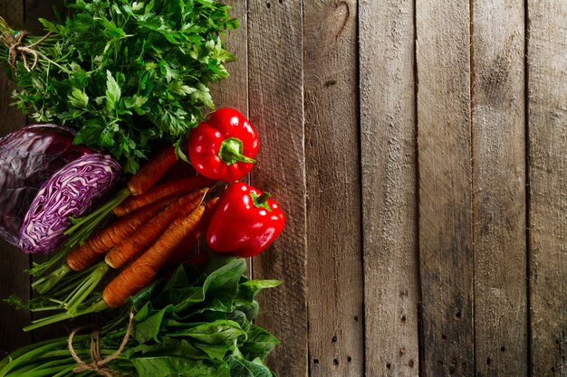 Free Photo food vegetable colorful background. tasty fresh vegetables on wooden table. top view with copy space.