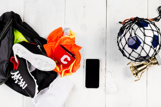 Free Photo football composition with ball in net and bag