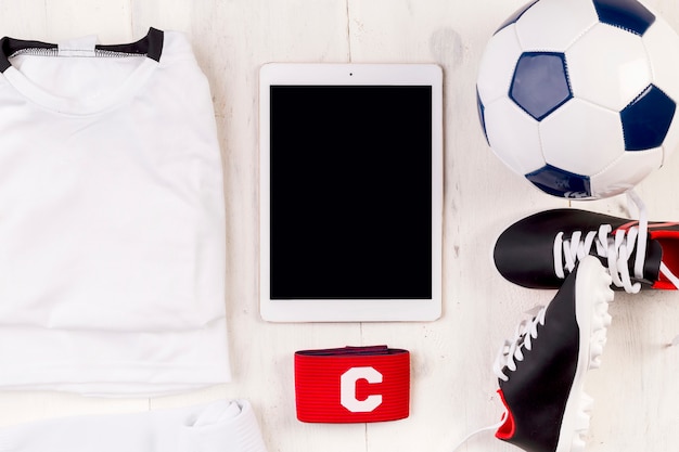 Free photo football composition with tablet