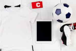 Free photo football composition with tablet