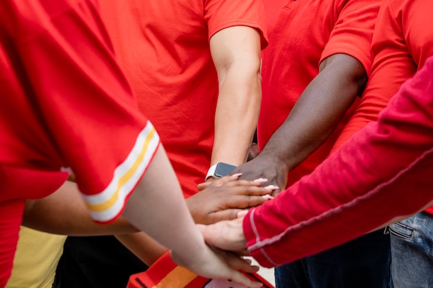 Free photo football fans in a huddle at a tailgate party