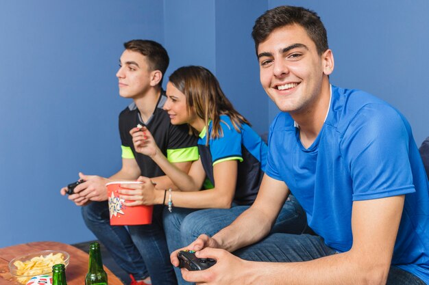 Football fans in living room