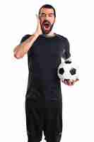 Free photo football player doing surprise gesture