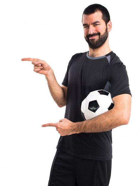 Football player pointing to the lateral