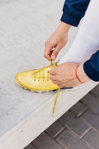 Free photo football player with yellow shoes