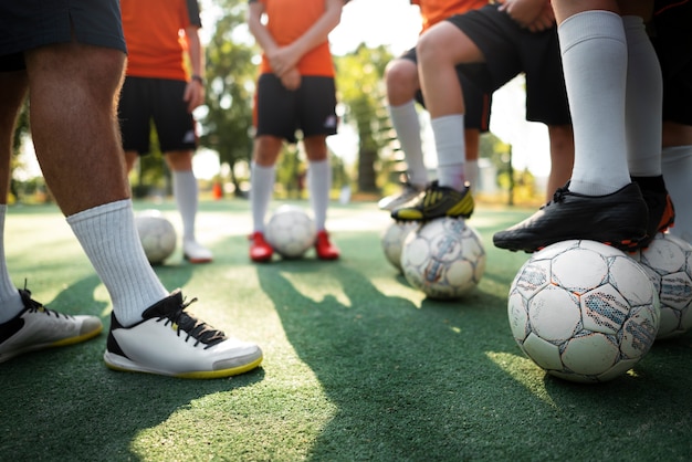 Free photo football trainer teaching his pupils