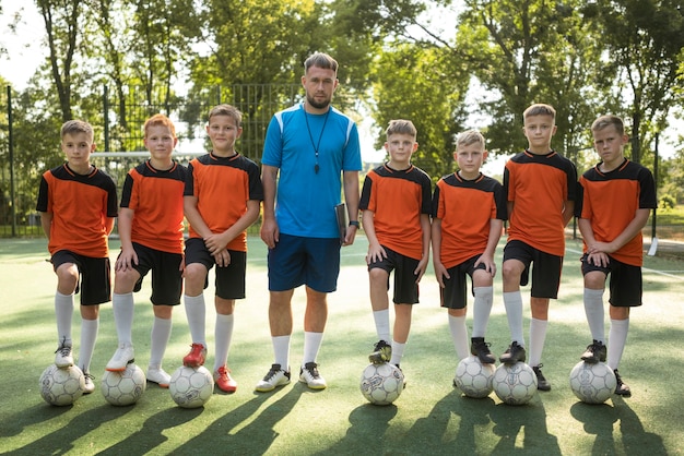 Football trainer teaching his pupils