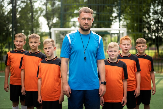 Football trainer teaching his pupils