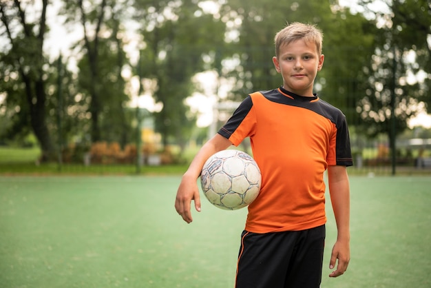 Free photo football trainer teaching his pupils