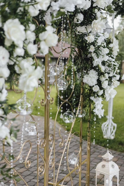 Free Photo forged gates are decorated with fresh white flowers and greenery