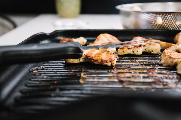 Free Photo fork on pieces of grilled meat