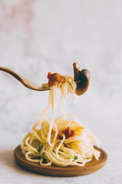 Fork taking delicious pasta