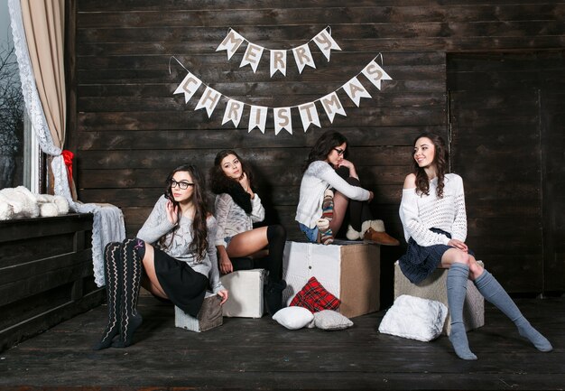 Four charming model posing on a vintage background