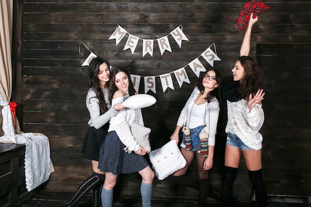 Four charming model posing on a vintage background