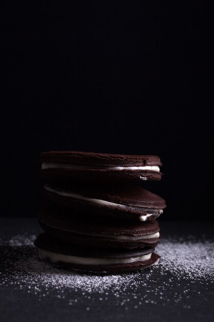 Four chocolate cookies filled of cream