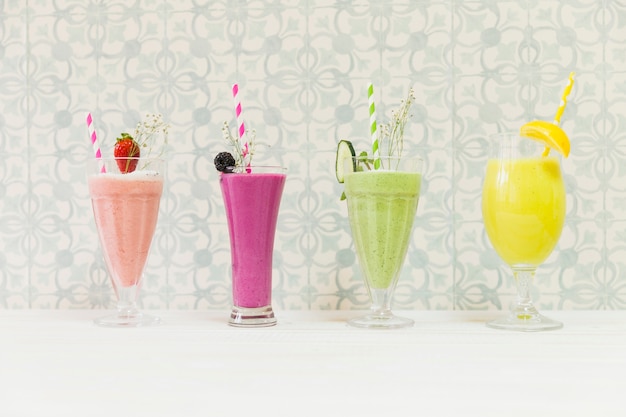 Free photo four delicious summer smoothies