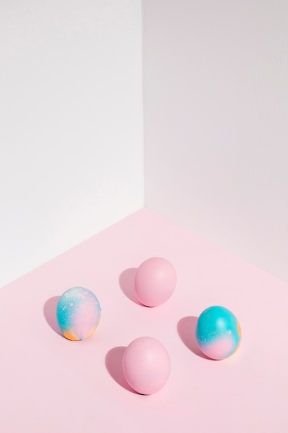 Free Photo four easter eggs scattered on table