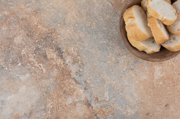 Fragrant bread slices in wooden bowl