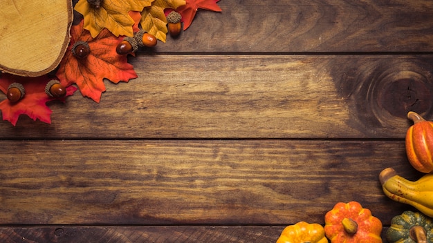 Free photo frame of autumn leaves and pumpkins