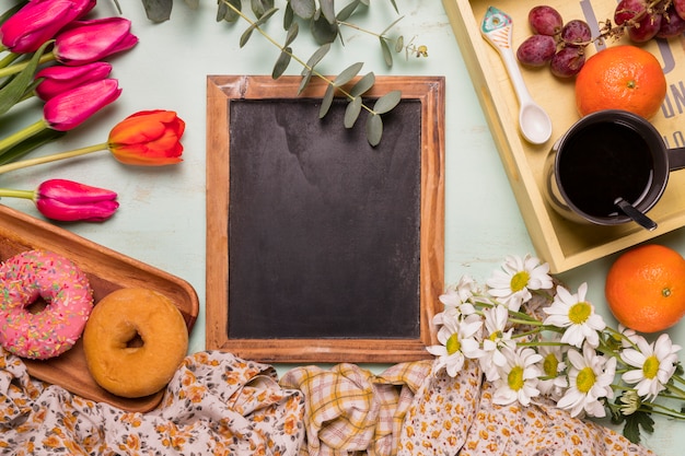 Frame chalkboard with sweet arrangement of breakfast