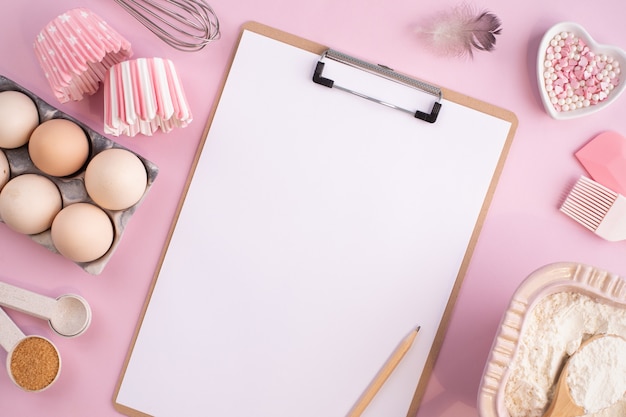 Frame of food ingredients for baking on a gently pink pastel background. Cooking flat lay with copy space. Top view. Baking concept. flat lay