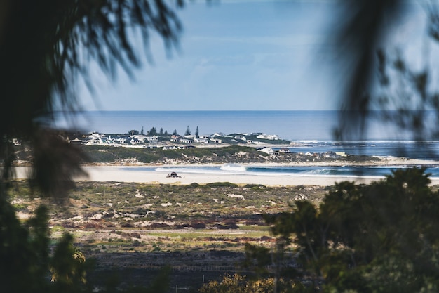 Free Photo frame in a frame hot of a village coast under a clear blue sky