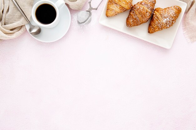 Frame of french croissants and coffee copy space