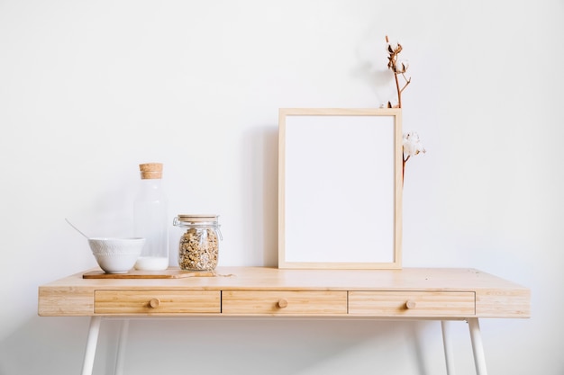 Frame and glasses on table