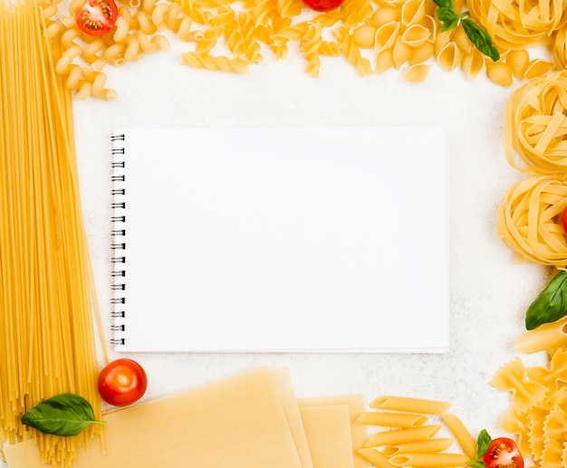 Frame of italian pasta with notebook