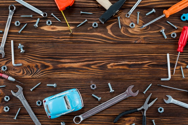 Free Photo frame made of different tools and toy car