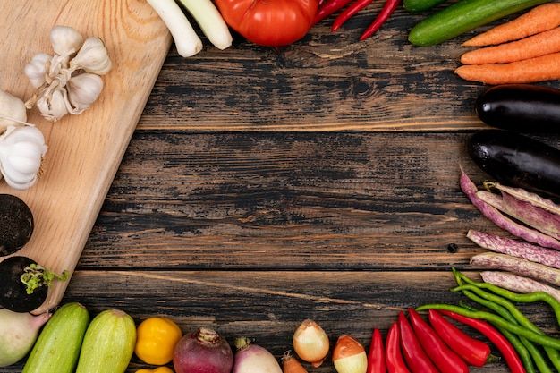 Frame made of different vegetables and a cutting board