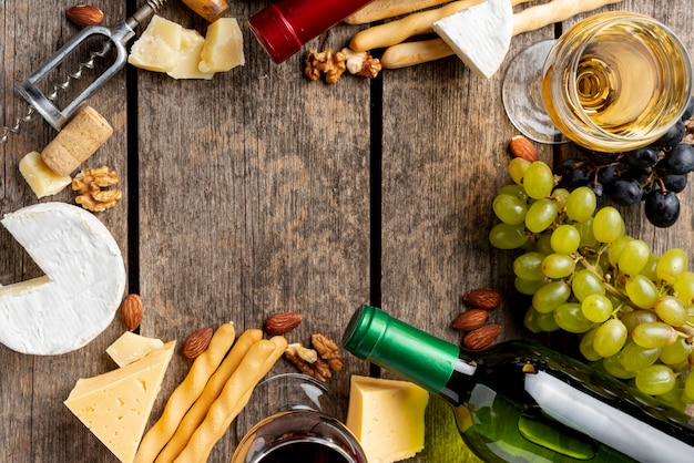 Frame of wine bottle, glass and wine snack