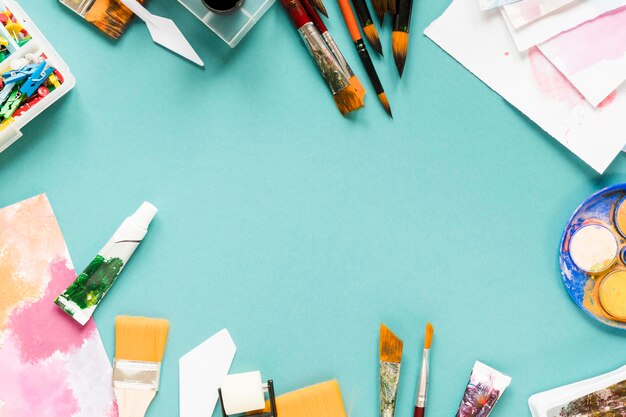 Frame with artist tools on table