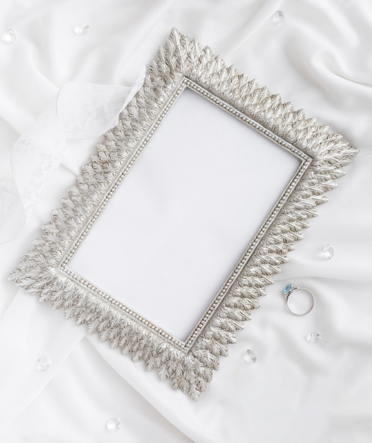 Free photo frame with engagement ring beside